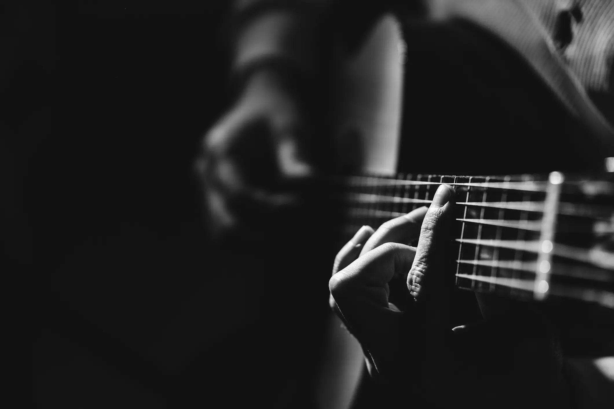 Acoustic guitar resting on a chair in warm natural light